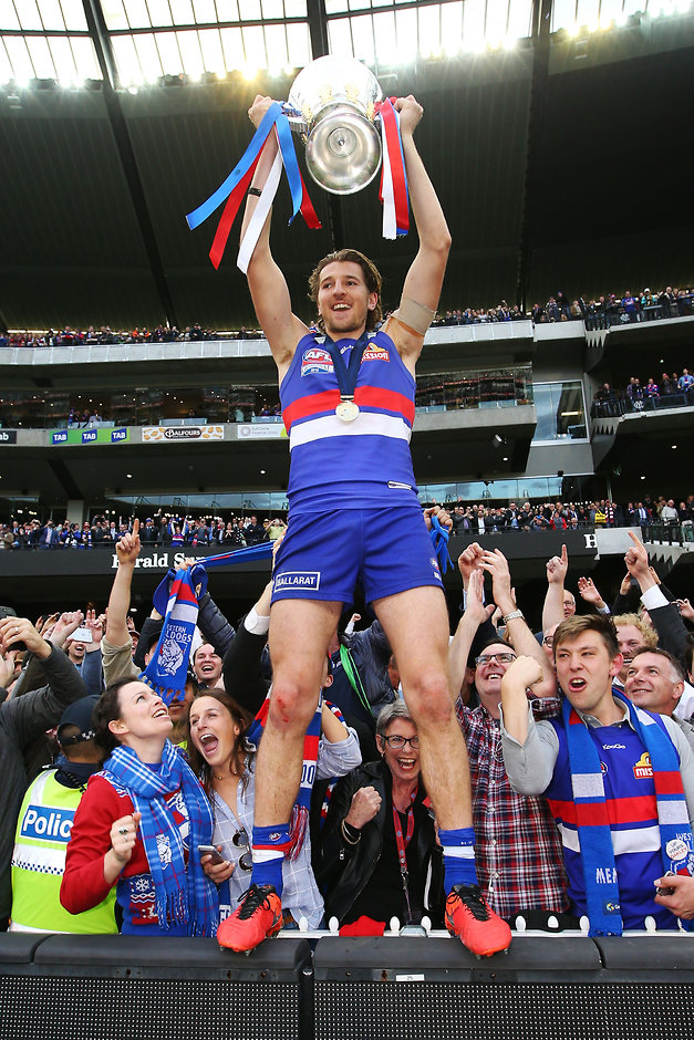 AFL 2016 Toyota AFL Grand Final - Sydney v Western Bulldogs MELBOURNE, AUSTRALIA - OCTOBER 01: Marcus Bontempelli of the Bulldogs celebrates the win with the cup during the 2016 Toyota AFL Grand Final match between the Sydney Swans and the Western Bulldogs at the Melbourne Cricket Ground on October 01, 2016 in Melbourne, Australia. (Photo by Michael Dodge/AFL Media)